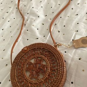 Handcrafted Round wicker cross body bag with leather accents